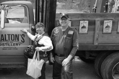 A happy couple wanting to take the distillery truck for a test drive.