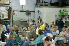 Crowd enjoying bluegrass music at open house event