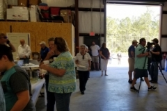 Onslow County Tourism taking pictures while guests eat lunch.