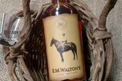 E.M. Walton's Corn Whiskey in a basket